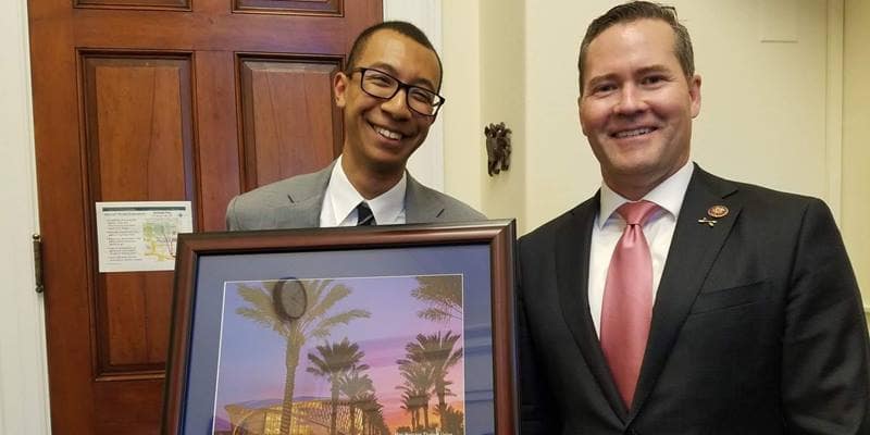 Dwayne Clark holds a photo of Embry-Riddle