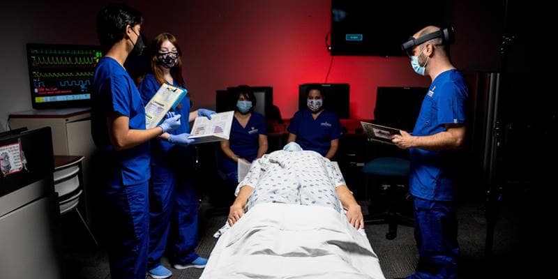 STAR Lab Director Dr. Joseph Keebler (right) leads students in a discussion about the interaction between teammates that is vital to caring for patients in high-stakes healthcare settings. (Embry-Riddle/David Massey)