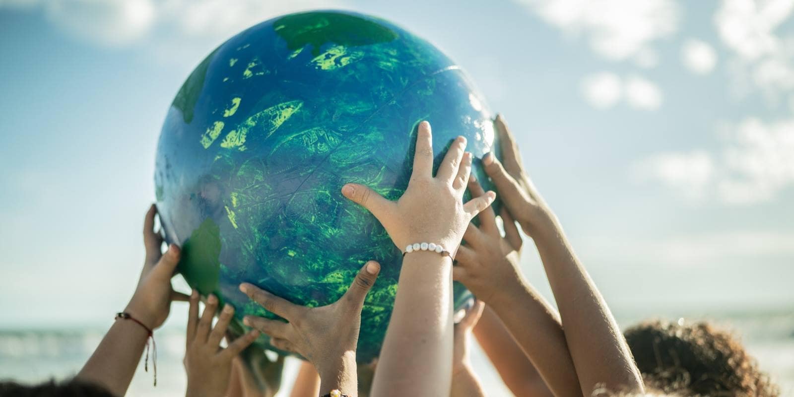 Children Holding a Planet Model